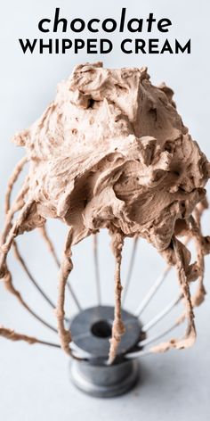 chocolate whipped cream in a metal mixer with the words, how to make chocolate whipped cream