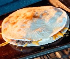 an uncooked tortilla is being cooked in the oven