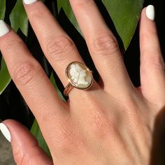 Vintage 10k Bezel Carved Natural Shell Cameo Ring Description: This vintage 10k ring features a carved natural shell cameo set in a bezel, adding a unique touch to your collection. Sized at 8 and weighing 4.31g, the shell's unique tone makes this ring a standout piece. As with all our pieces, this ring is a rare find--once it's gone, it's gone. Choosing this piece helps you stand out from the crowd while supporting sustainable practices. Why You'll Love It:      Unique Design: The carved shell cameo adds a distinctive and stylish touch.      High-Quality Craftsmanship: Ensures durability and lasting appeal.      Versatile Style: Perfect for both everyday wear and special occasions, making it a versatile addition to your jewelry collection.      Rare and Exclusive: Stand out from the rest. Gold Cameo Signet Ring Collectible, Gold Signet Ring With Cameo Collectible, Classic Oval Cameo Jewelry, Classic Oval Cameo Rings, Vintage Cameo Signet Ring For Anniversary, Victorian Cameo Rings For Anniversary, Antique Oval Cameo Signet Ring, Classic Gold Cameo Signet Ring, Classic Gold Signet Ring With Cameo