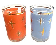 two glass candles with different designs on them