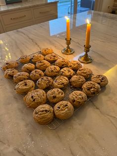 cookies and candles on a marble counter top