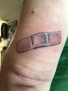 a person with a tattoo on their arm that has a piece of bread in it