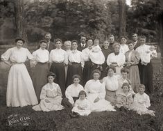 an old black and white photo of people in dresses