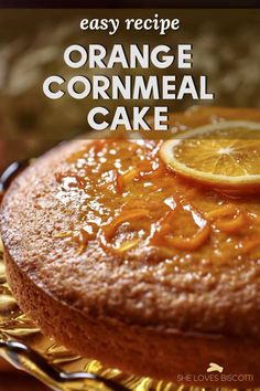 an orange cornmeal cake on a gold platter with the words easy recipe