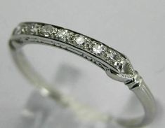 a white gold ring with diamonds on it