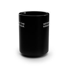 a black coffee mug with white lettering on the inside and bottom, sitting in front of a white background