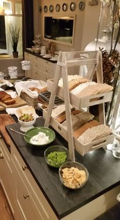 a kitchen counter topped with plates and bowls filled with different types of food on top of it