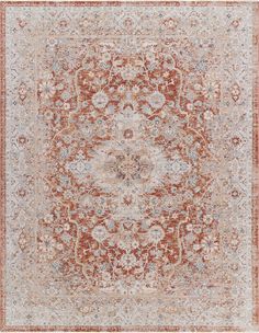 an orange and beige rug with floral designs