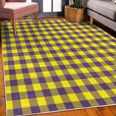 a blue and yellow rug in a living room