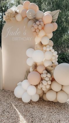 balloons and foliage decorate the entrance to jade's birthday