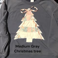 a gray sweatshirt with a christmas tree on the front that says medium gray christmas tree