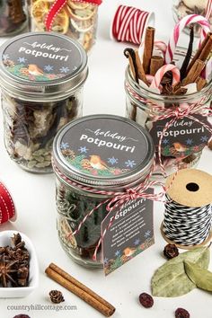 three jars filled with different types of christmas treats