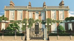 a large brick building with an iron gate in front of it and lots of windows