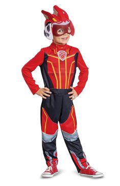 a young boy in a red and black costume standing with his hands on his hips