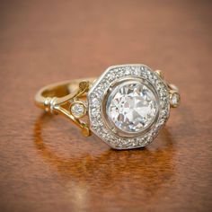 an antique diamond ring on a wooden table