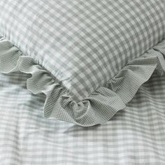 a close up of a pillow with ruffles on it