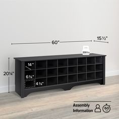 a large black bookcase with measurements for the width and height, against a white wall