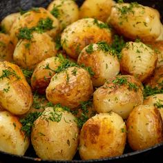 potatoes with herbs and seasoning in a skillet