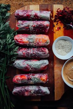 the food is wrapped in plastic and ready to be eaten, including carrots, chives, sesame seeds, and other ingredients