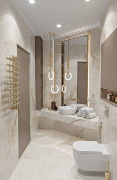 an elegant bathroom with marble walls and flooring