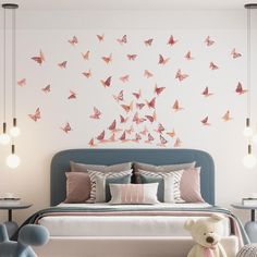 a bedroom with a bed, teddy bear and butterflies on the wall