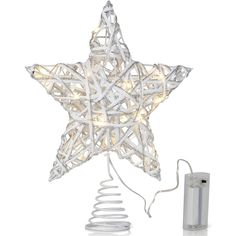 a white star shaped light on top of a table next to a spiral wire lamp