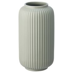 a large white vase sitting on top of a table