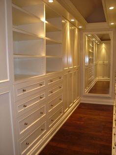 a white closet with drawers and lights on the ceiling is shown in an instagramted post