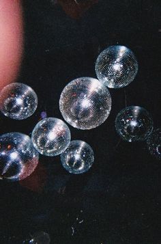 several shiny bubbles floating in the air