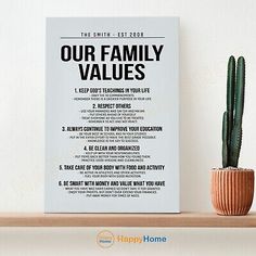 a poster with the words our family values on it next to a potted cactus