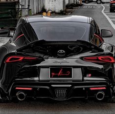 the rear end of a black sports car