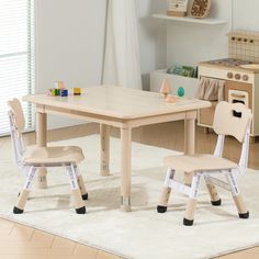 a child's table and chair set in a room with white carpeted flooring