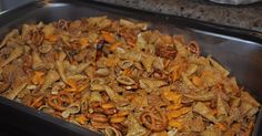 a large metal pan filled with food on top of a stove