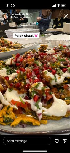 a plate full of food sitting on top of a table next to another plate filled with food