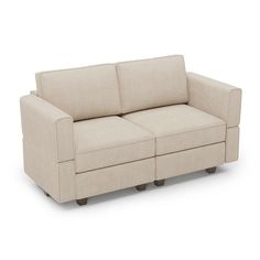 a beige couch sitting on top of a white floor