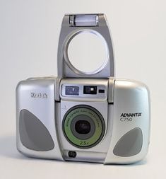 an old digital camera sitting on top of a table