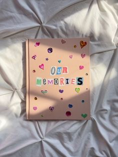 a pink book with the words our memories written on it