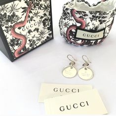 Authentic,New,Sterling Silver Earrings With Gucci Logo,Aprox.1-3/4 L3/4 W3/16h,Made In Italy,French Hook, Back Is Blank,Possibility For Engraving. Gucci Luxury Drop Earrings, Classic Gucci Earrings For Anniversary, Gucci Sterling Silver Earrings For Formal Occasions, Gucci White Gold Round Earrings, Gucci Luxury Sterling Silver Earrings, Gucci White Gold Sterling Silver Earrings, Luxury Gucci Sterling Silver Earrings, Gucci Sterling Silver Earrings As Gift, Gucci Sterling Silver Earrings For Gift