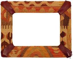 an old photo frame with brown leather trimmings and a pattern on the front