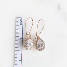 Simple Rose Gold Bridal Drop Earrings. Cubic Zirconia Drops. Elegant Dangle Earrings. Lovely, elegant and simple! These earrings are perfect for just about any occasion. They are simple and yet the earwire is long (with 3 sizes you can choose from), adding a unique and interesting element to these earrings! Made with cubic zirconia drops and rose gold plated brass ear wire. Also available in - Gold: www.etsy.com/listing/855456286/simple-gold-bridal-drop-earrings-cubic Silver: www.etsy.com/listin Bridal Drop Earrings, Rose Gold Drop Earrings, Petite Earrings, Gem Jewelry, Bridal Earrings Drop, Simple Rose, Rose Gold Bridal, Heart Gemstone, Wedding Jewelry Earrings