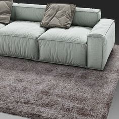 a couch sitting on top of a carpet covered floor