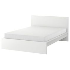 a white bed frame with no sheets on it