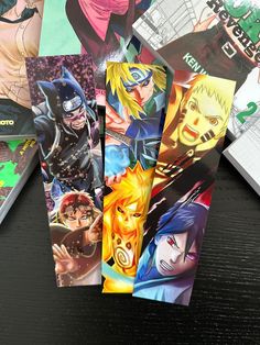 some anime cards are laying on a table