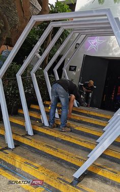 two people are climbing up some stairs