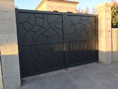 an iron gate in front of a house