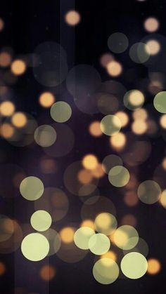 blurry image of lights in the dark with bokeh effect to it's background