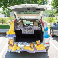 the back end of a car decorated with cartoon characters