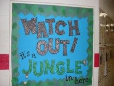 a sign that says watch out it's a jungle in here on the wall