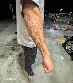 a man with a tattoo on his arm