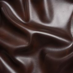 a close up view of a brown leather textured material that looks like it has been dyed